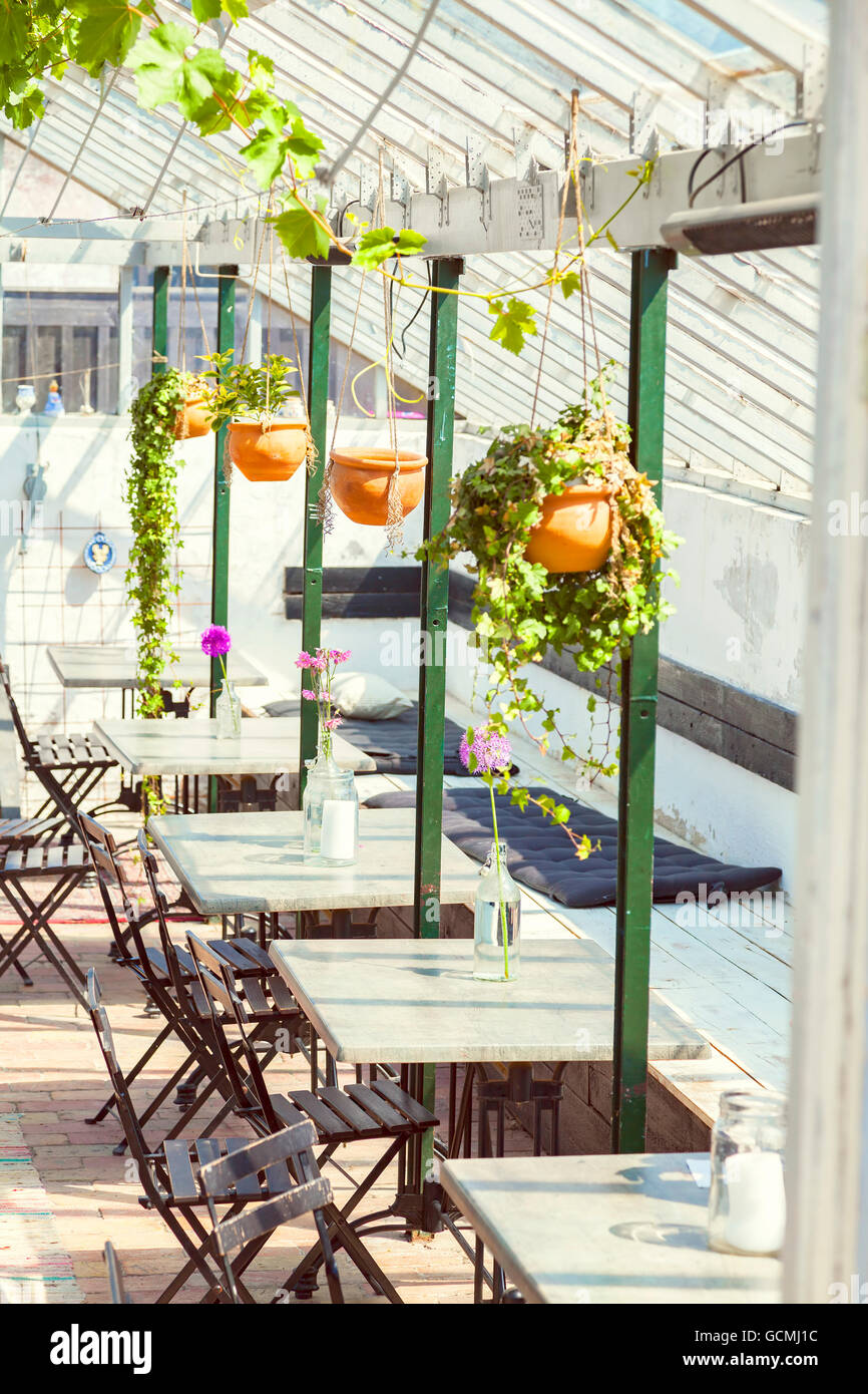 Image of cozy green house cafe. Stock Photo