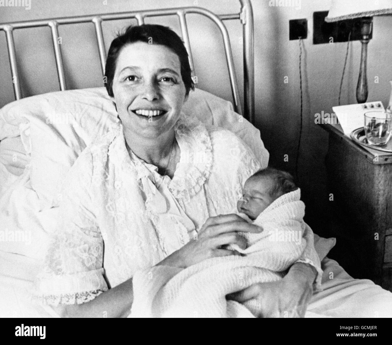 A happy smile from American actress Patrica Neal after giving birth to