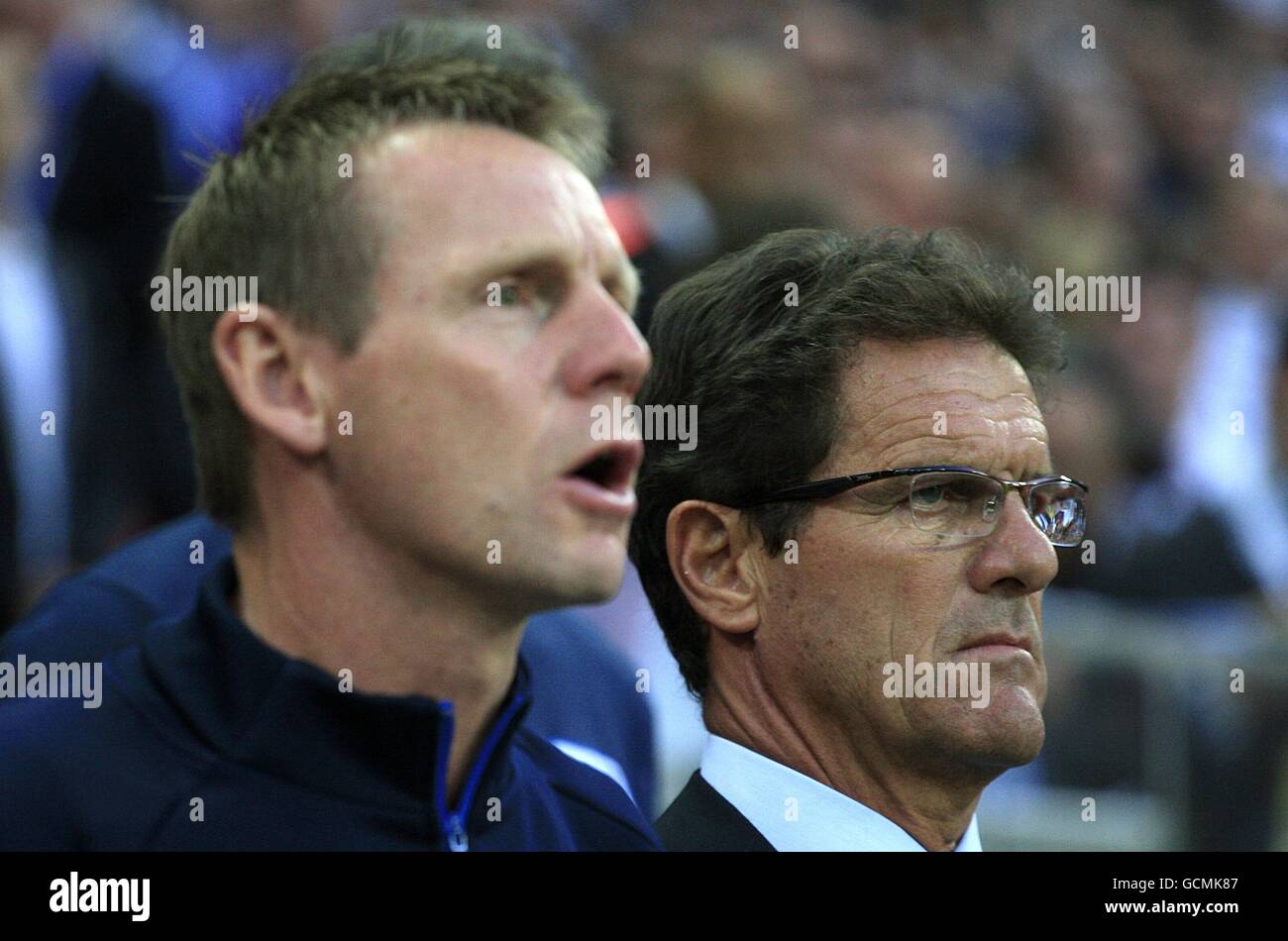 Soccer - International Friendly - England v Hungary - Wembley Stadium. England manager Fabio Capello (right) and his assistant Stuart Pearce (left) during the national anthem Stock Photo