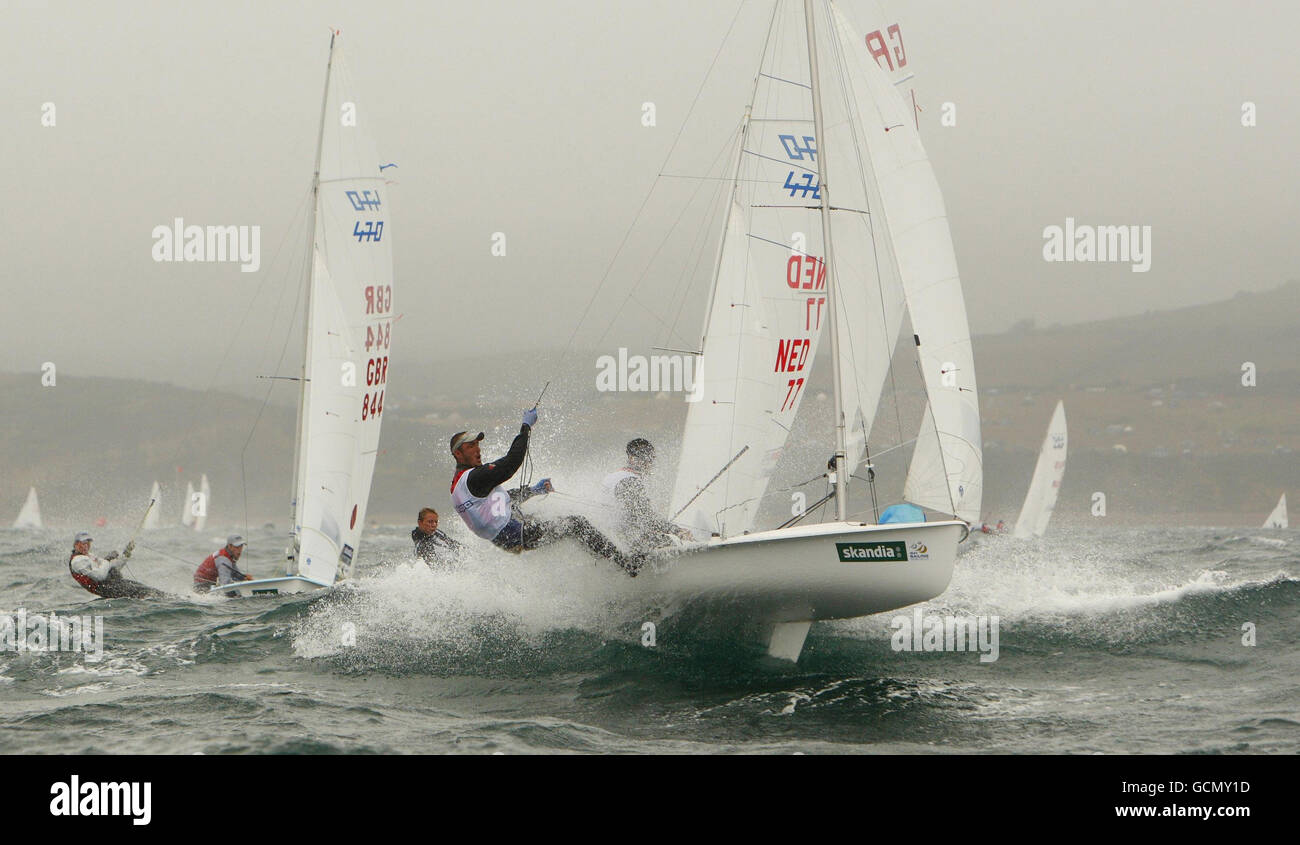 The British 470 men's pairing of Luke Patience and Stuart Bithell (GBR844, left) chase the leaders during racing on the second day at the Sail For Gold Regatta in Weymouth Bay, Dorset. Stock Photo