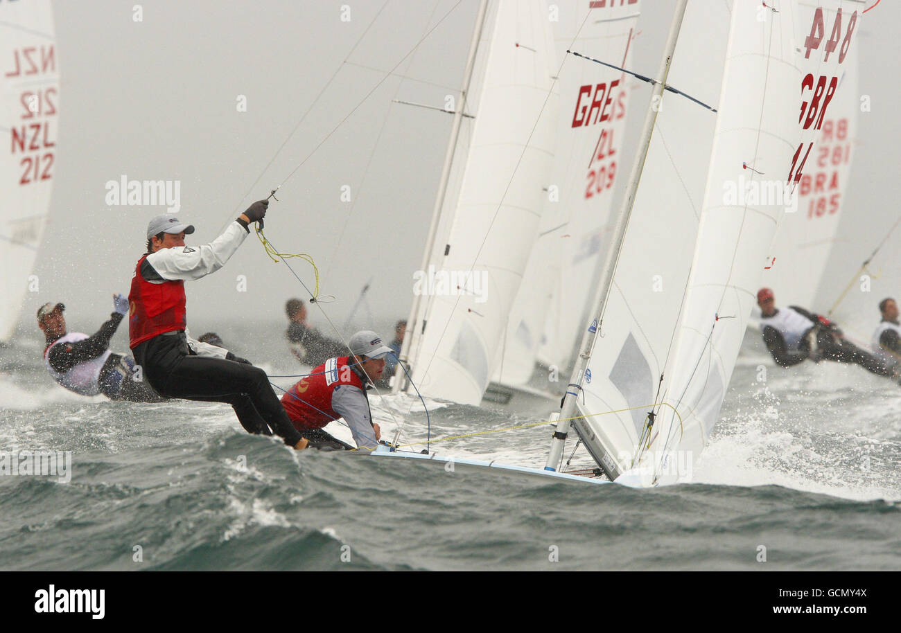 The British 470 men's pairing of Stuart Bithell (left) and Luke Patience racing on the second day at the Sail For Gold Regatta in Weymouth Bay, Dorset. Stock Photo
