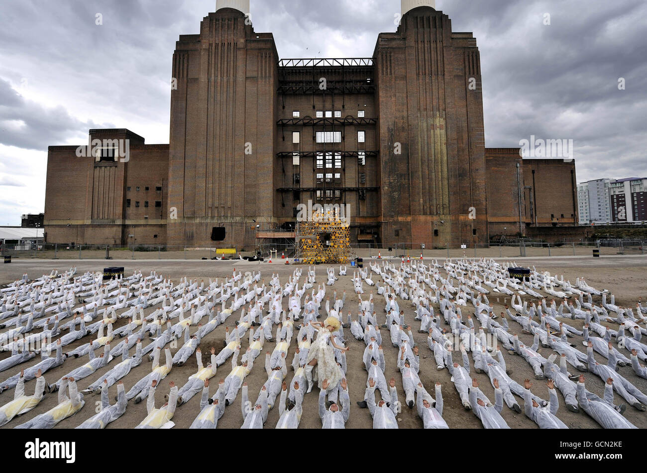 Around 500 actors for The National Youth Theatre of Great Britain perform S'Warm at Battersea Power Station in London to raise awareness of the alleged global environmental crisis caused by dwindling bee populations. Stock Photo
