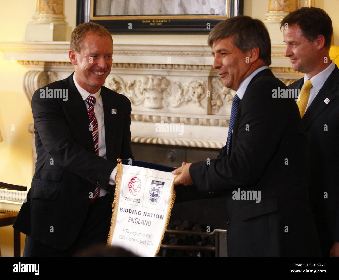 England 2018 CEO Andy Anson (left) presents a pennant to Leader of the FIFA inspection team Harold Mayne Nicholls during a football World Cup 2018 bid event at Number 10, Downing Street in London. Stock Photo