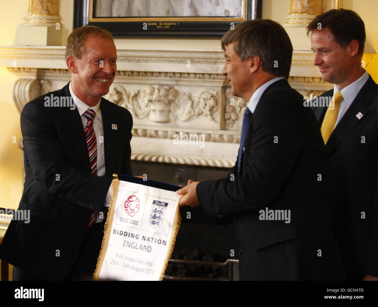 England 2018 CEO Andy Anson (left) presents a pennant to Leader of the FIFA inspection team Harold Mayne Nicholls during a football World Cup 2018 bid event at Number 10, Downing Street in London. Stock Photo