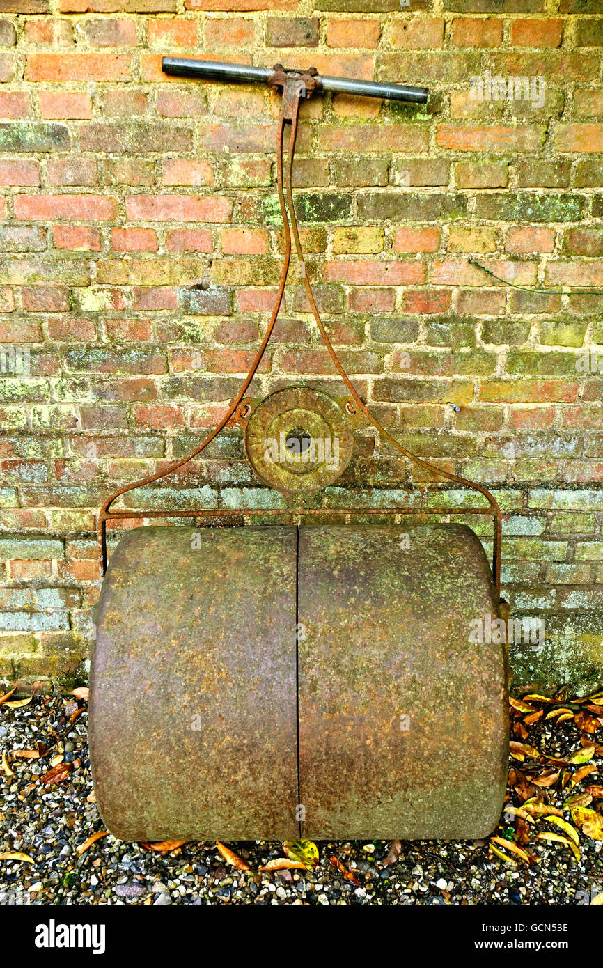 OLD METAL GARDEN ROLLER FOR LAWNS Stock Photo