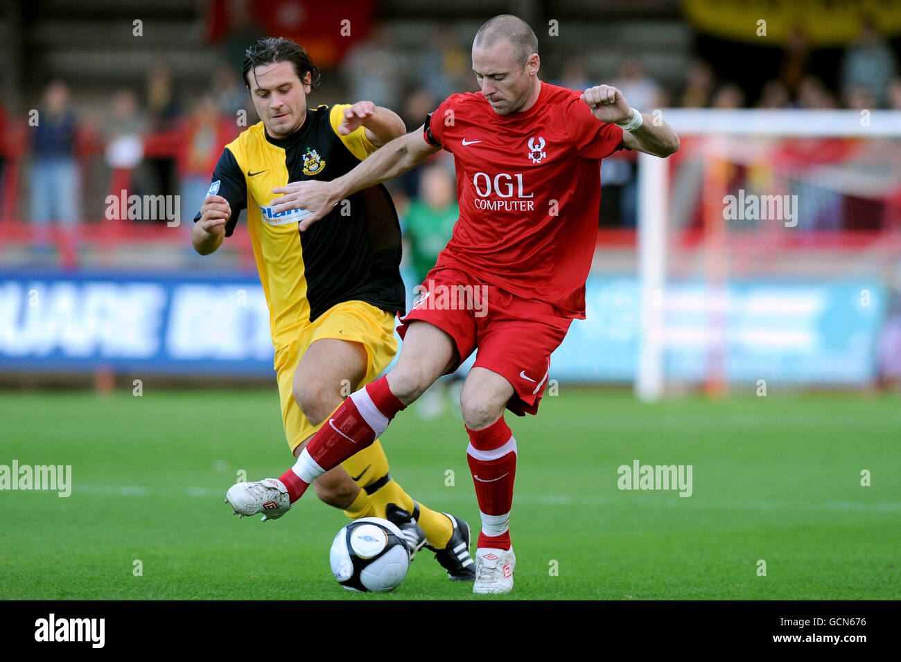 Kidderminster Harriers' Mark Albrighton (right) and Southport's Ashley Winn (left) battle for the ball Stock Photo