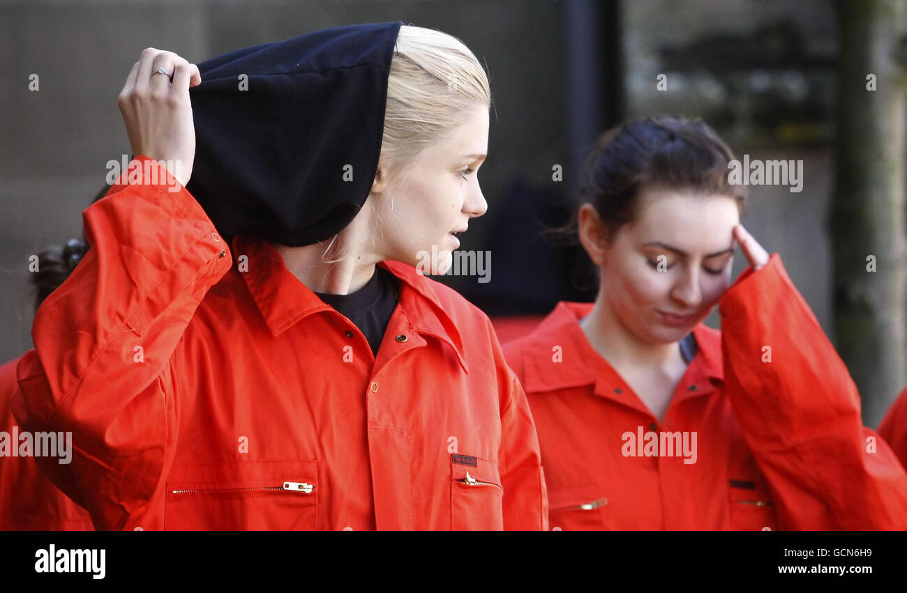 Volunteers take part in a protest against human rights abuses at Guantanamo Bay and elsewhere in the world, during a demonstration outside of St John's Church on Princes Street in Edinburgh. Stock Photo