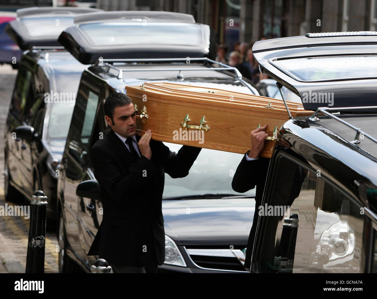 The Coffins Of Austin Luke And Cecilia Riggi Are Put Into Hearses After Their Funeral At St Mary S Cathedral In Aberdeen Stock Photo Alamy