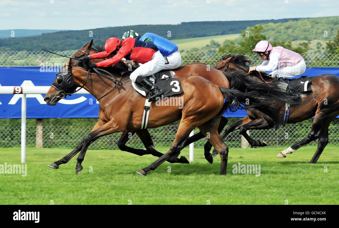 Drunken Sailor (left) ridden by Kieren Fallon wins the Windflower March stakes at Goodwood Racecourse, Chichester. Stock Photo