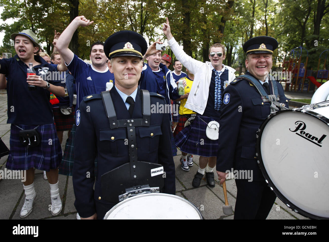Scottish football fans in the centre of Kaunas as a local Lithuanian brass band play in the streets ahead of the UEFA European Championship Qualifying match at the Darius Girenas Stadium, Kaunas. Stock Photo