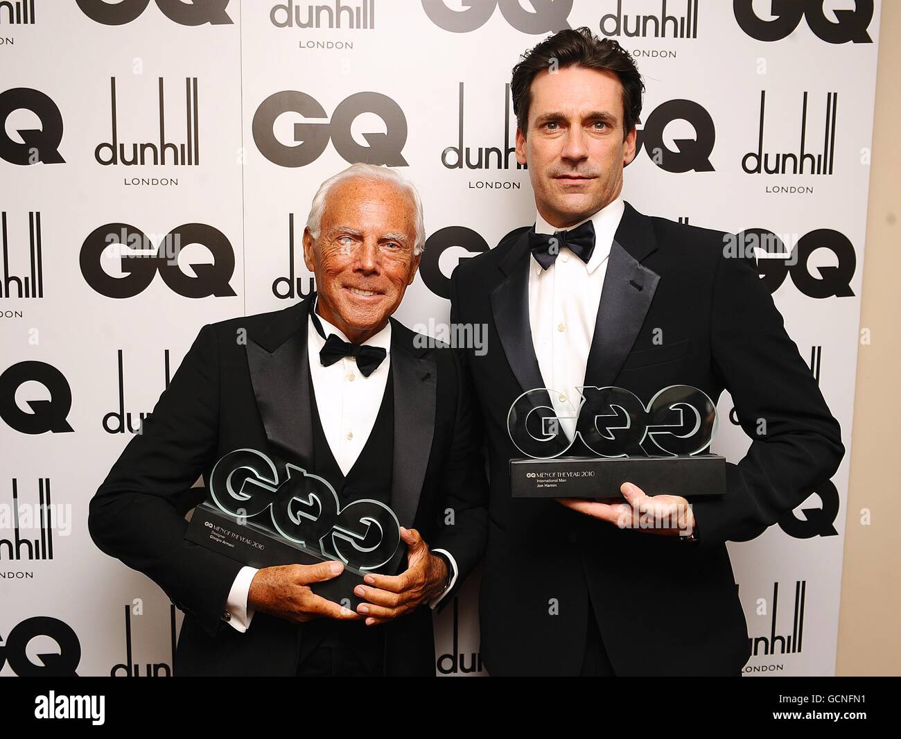 Jon Hamm right and Giorgio Armani with their awards at the 2010 GQ Men of the Year Awards at the Royal Opera House Covent Garden London Stock Photo Alamy