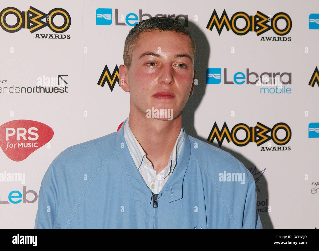 British rapper Devlin arrives at the May Fair hotel in central London for the 2010 MOBO awards nominations. Stock Photo