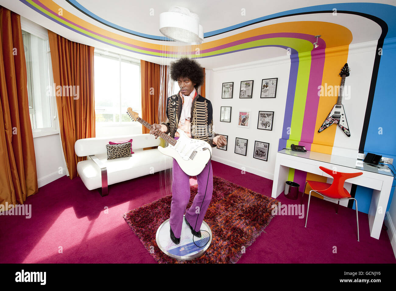 A wax figure of Jimi Hendrix, on loan courtesy of Madame Tussauds, is placed on show in a suite at the Cumberland hotel in central London to mark the 40th anniversary of his death on 18th September 2010. Stock Photo