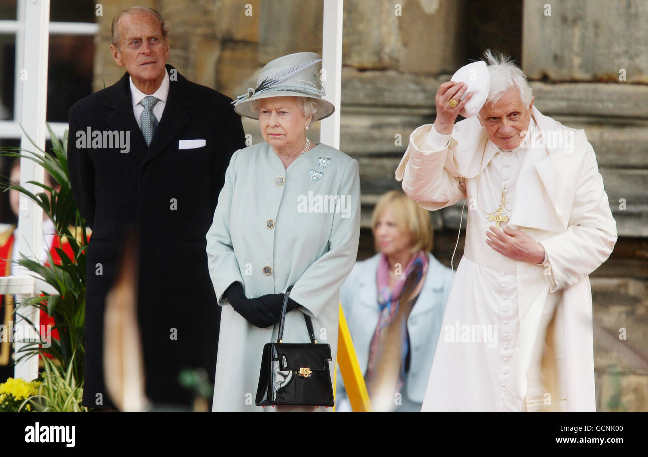 Pope Benedict XVI replaces his zucchetto as he meets with Queen Elizabeth II and the Duke of Edinburgh at the Palace of Holyroodhouse in Edinburgh on the first day of his four day visit to the United Kingdom. Stock Photo