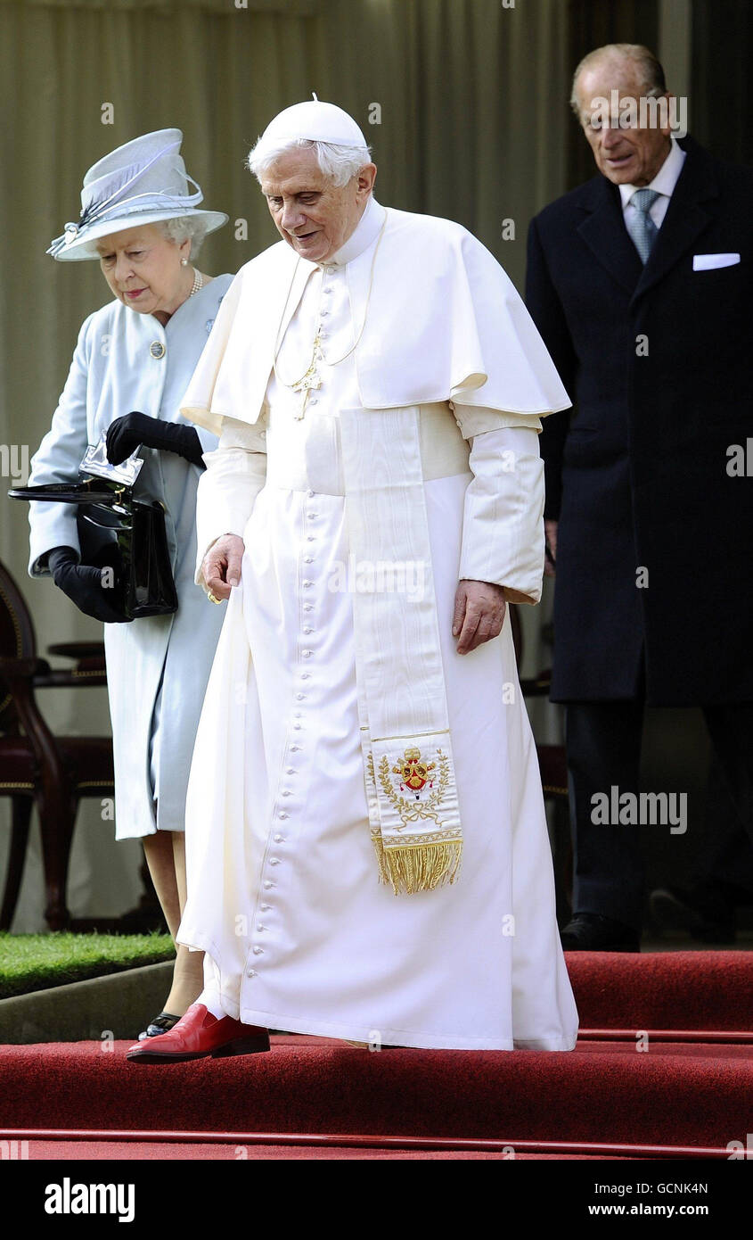 Britain's Queen Elizabeth II and Pope Benedict XVI walk with the Duke of Edinburgh walk through the gardens at the Palace of Holyroodhouse in Edinburgh, on the first day of his four day visit to the United Kingdom. Stock Photo