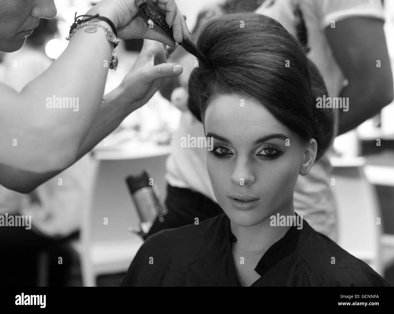 BLACK AND WHITE ONLY A model backstage has her hair worked on prior to the Issa Spring/Summer show at Somerset House as part of London Fashion Week. Stock Photo