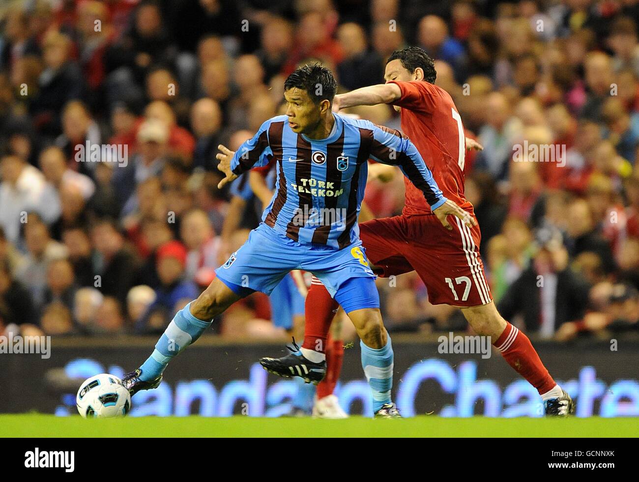 Soccer - UEFA Europa League Final Qualifying Round - First Leg - Liverpool v Trabzobspor - Anfield. Liverpool's Rodriguez Maxi (right) and Trabzonspor's Teofilo Gutierrez (left) battle for the ball Stock Photo