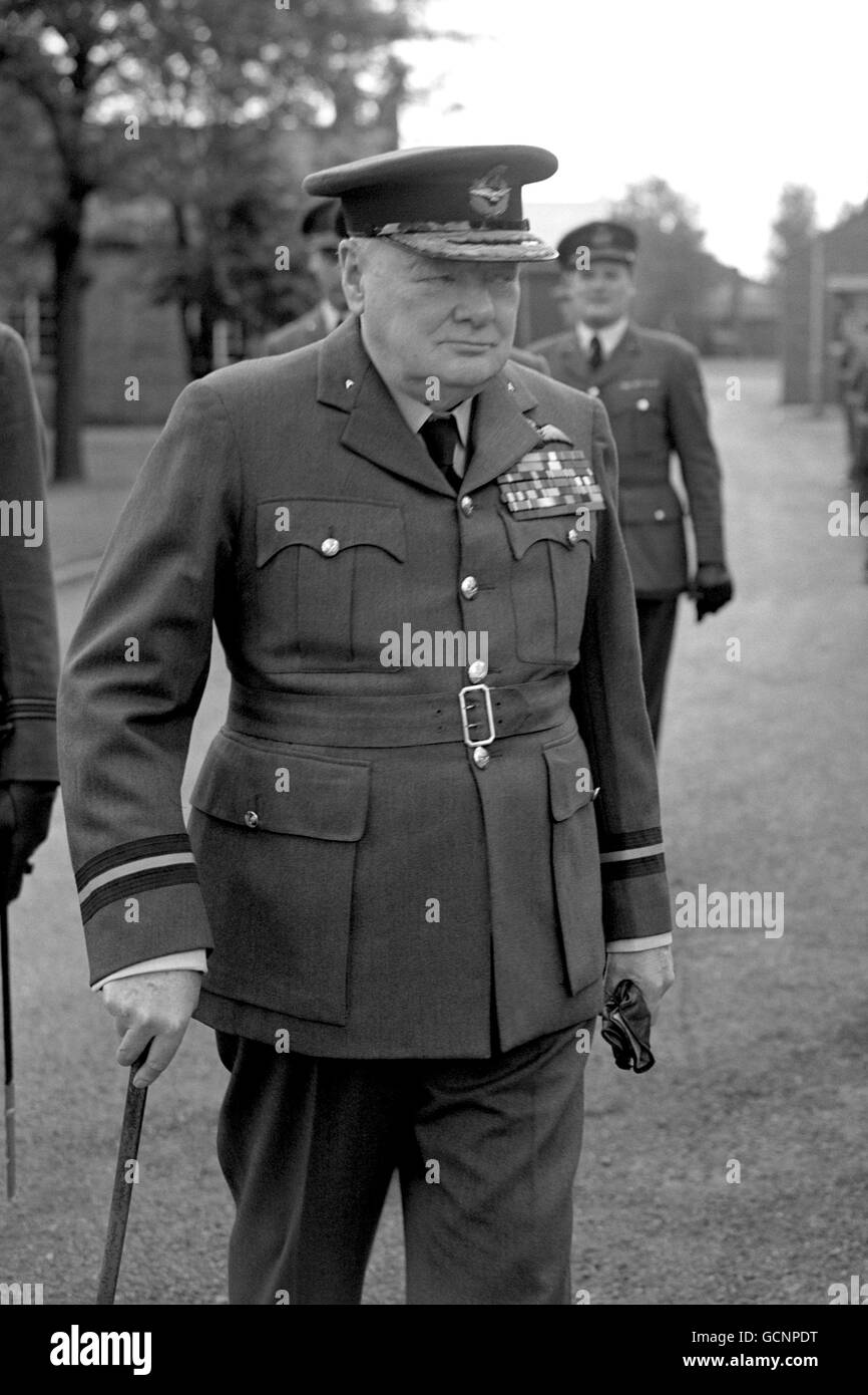 Leader of the Opposition, Winston Churchill wears his Air Commodore's uniform, as he inspects the guard of honour during his visit to 615 (County of Surrey) Squadron, Royal Auxiliary Air Force, at Biggin Hill Aerodrome, Kent. Stock Photo