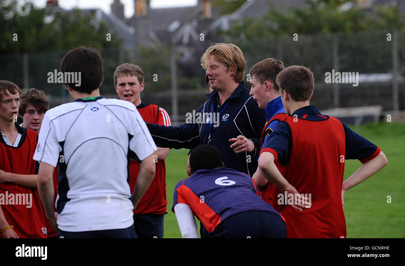 Former Edinburgh player Simon Cross coaches Youngsters during the Grampian School Rugby Goes for Gold event at Aberdeen Grammar School, Aberdeen. Stock Photo