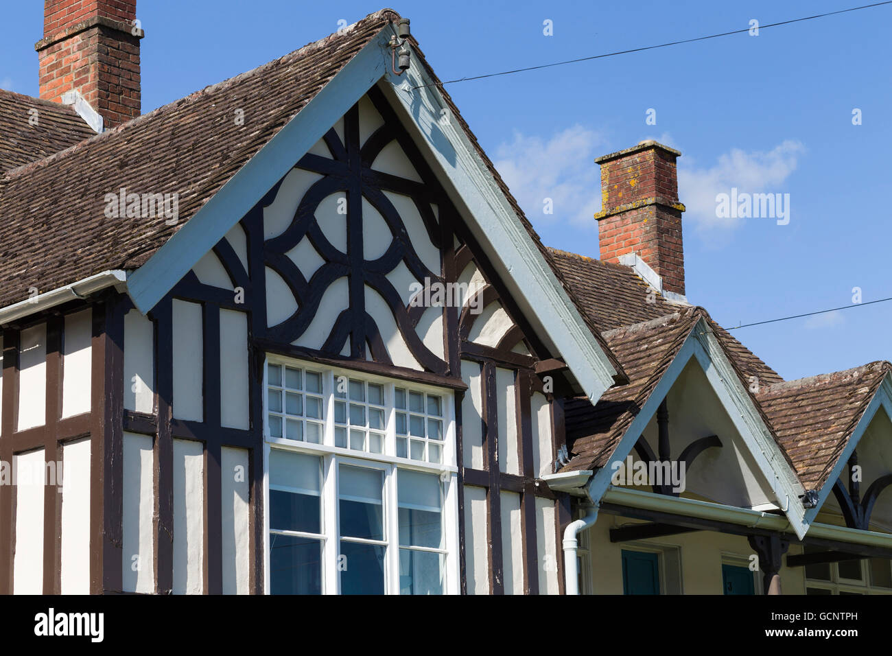 A decorative neo-Tudor style timber gable at Rowland Hill's almshouses, a Victorian building of 1887, in Wotton-under-Edge. Stock Photo