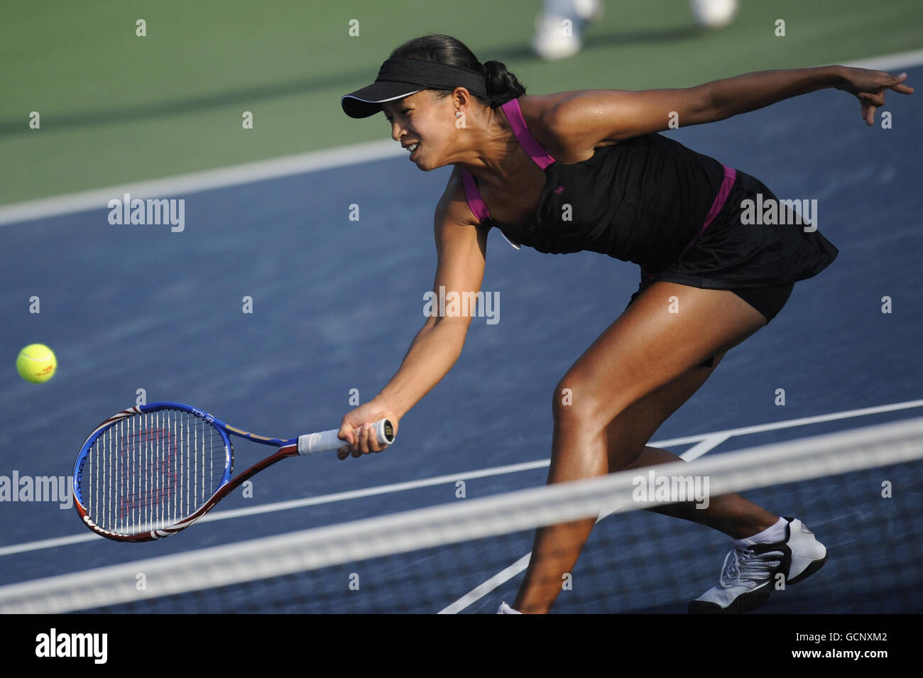 Great Britain's Anne Keothavong in doubles action against Switzerland's Timea Bacsinszky and Tathiana Garbin (out of picture) during day four of the US Open, at Flushing Meadows, New York, USA. Stock Photo