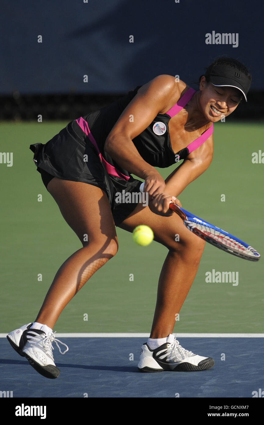 Great Britain's Anne Keothavong in action against Switzerland's Timea Bacsinszky and Tathiana Garbin (out of picture) during day four of the US Open, at Flushing Meadows, New York, USA. Stock Photo