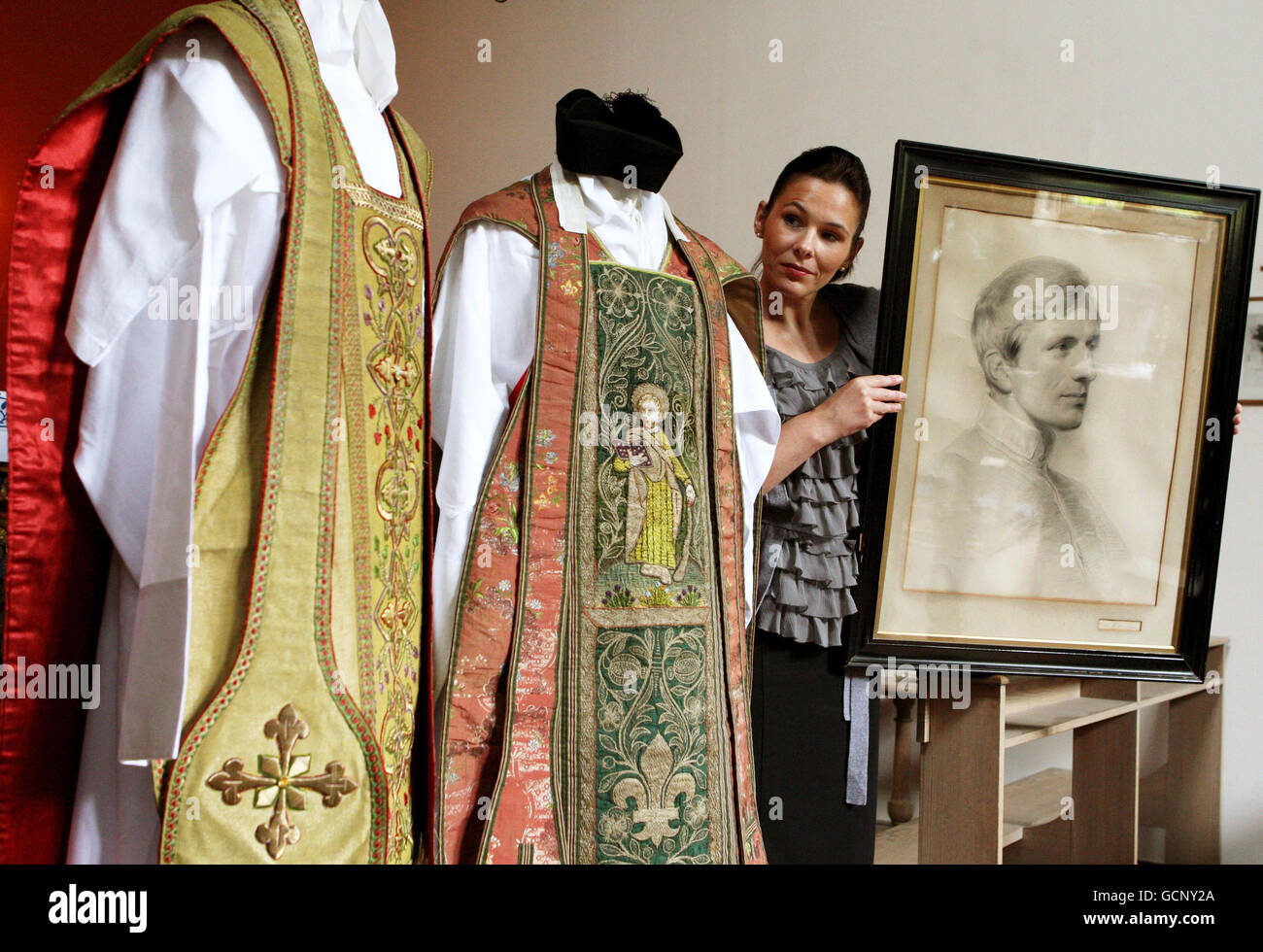 Katherine Milby views two vestments once owned by Cardinal Newman and a drawing of him on display at Sir Walter Scott's Abbotsford home in Melrose, Scottish Borders. The Cardinal will be beatified by the Pope during his forthcoming visit to the UK. Stock Photo