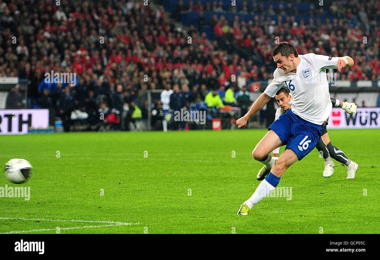 Soccer - UEFA Euro 2012 - Qualifying - Group G - Switzerland v England - St. Jakob-Park. England's Adam Johnson scores his side's second goal of the game after taking the ball past Switzerland goalkeeper Diego Benaglio Stock Photo