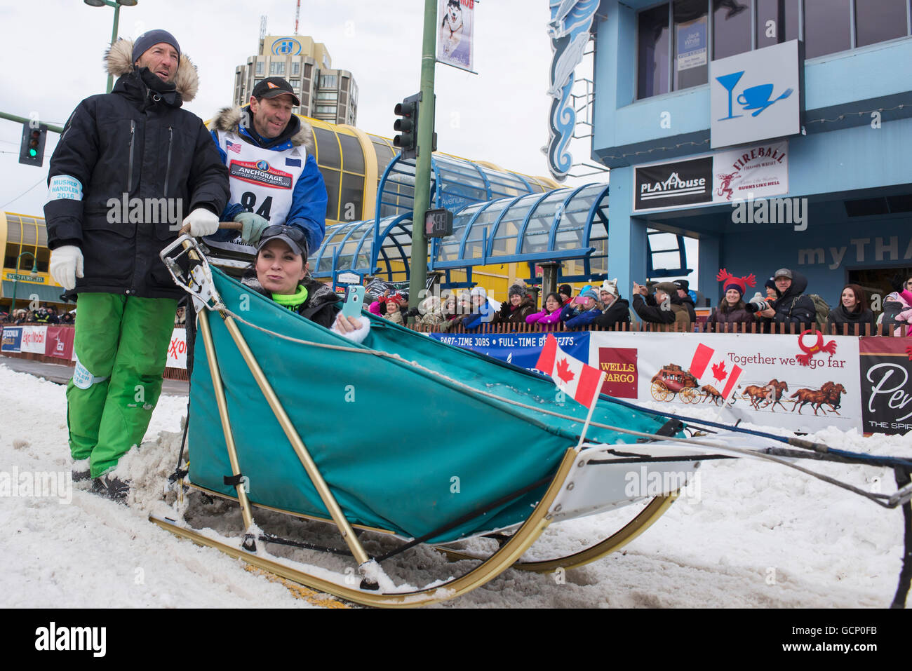 Hans Gatt and team leave the ceremonial start line with an Iditarider during the 2016 Iditarod Stock Photo