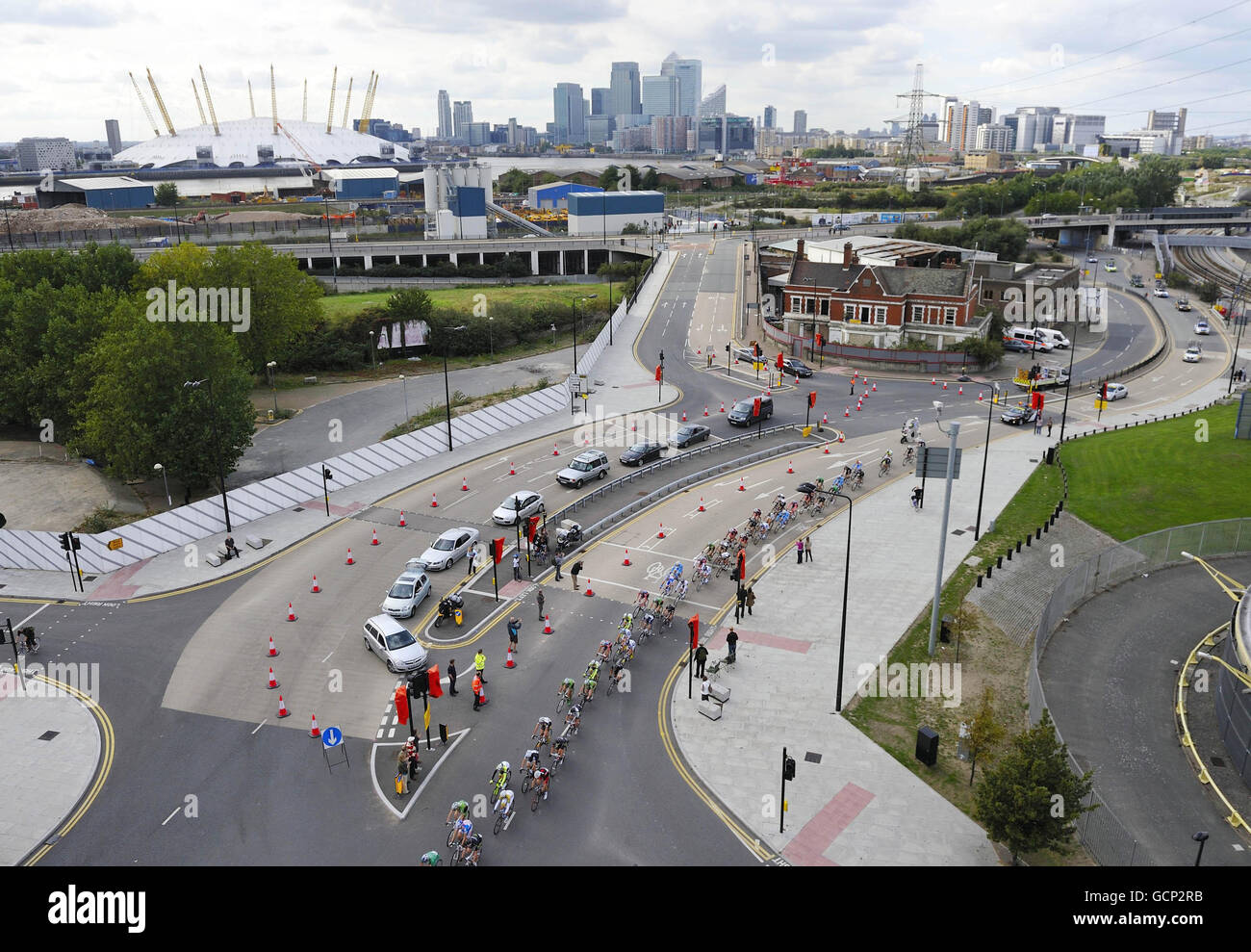 Riders pass through London's Docklands during stage 8 of of the Tour of Britain in London. Stock Photo
