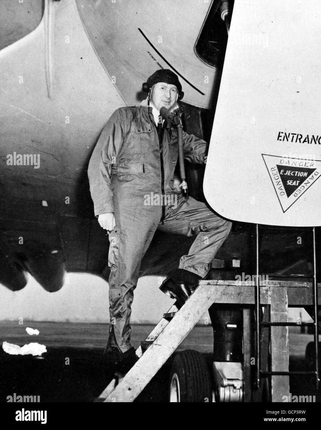 Mr. Duncan Sandys, Minister of Supply, is pictured as he left a Delta-wing Avro Vulcan jet bomber at Woodford Airport, near Manchester on March 13th 1954 after a flight during which he took over the aircraft's controls. The Minister made the flight, over the Isle of Wight and back by way of Holyhead, during a visit to the works of A.V. Roe and Co., Ltd., the aircraft's builders. The Vulcan, one of Britain's latest jet bombers, is believed to have reached more than 500 mph during the flight. Stock Photo