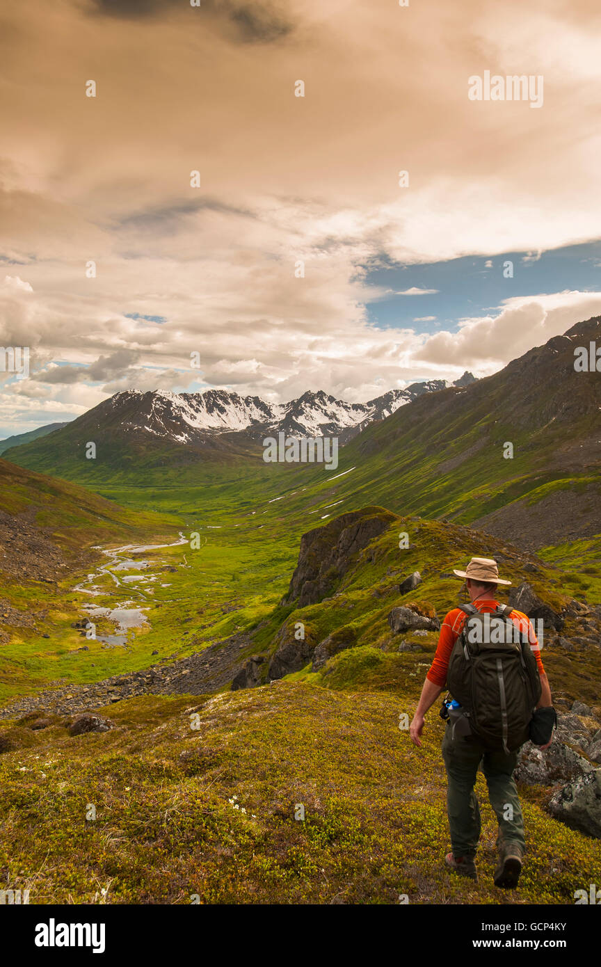 Man hikes the Reed Lakes Trail in Archangel Valley, Talkeetna Mountains