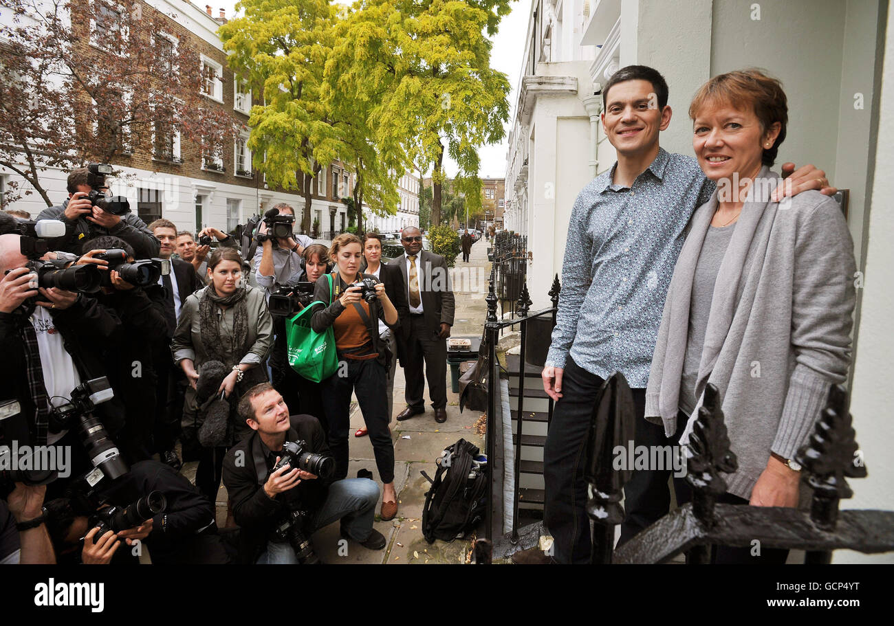 David Miliband and his wife Louise stand on the steps of their north London home, as nominations for the party's top team are due to close at 5pm, the shadow foreign secretary is widely expected to confirm his future plans later today. Stock Photo