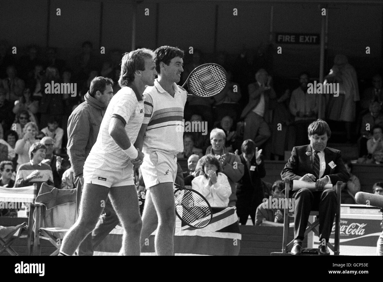 Britain's doubles partners Colin Dowdeswell (right) and John Lloyd leave the court after their victory over Shlomo Glickstein and Shahar Perkiss which gave Britain a 2-1 lead over Israel in the European Zone Davis Cup. Stock Photo