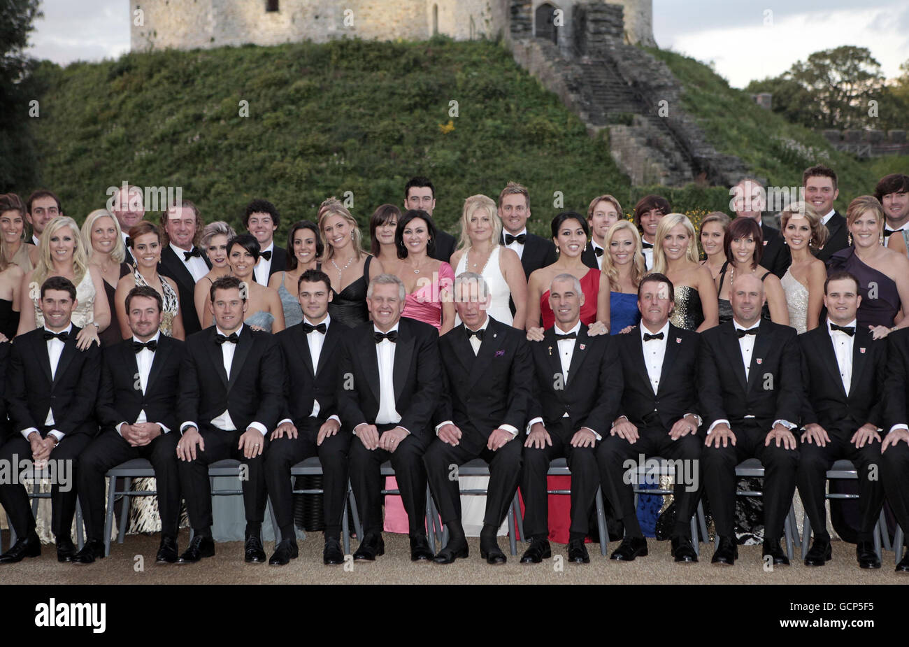 The Prince of Wales poses for a group photograph with the European and American Ryder Cup teams, accompanied by their wives and girlfriends at the Welcome to Wales 2010 Ryder Cup dinner at Cardiff Castle, Cardiff, south Wales, ahead of the Ryder Cup. Stock Photo