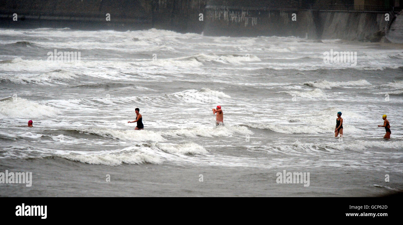 Brave swimmers enter the North Sea at Whitley Bay, North Tyneside, as