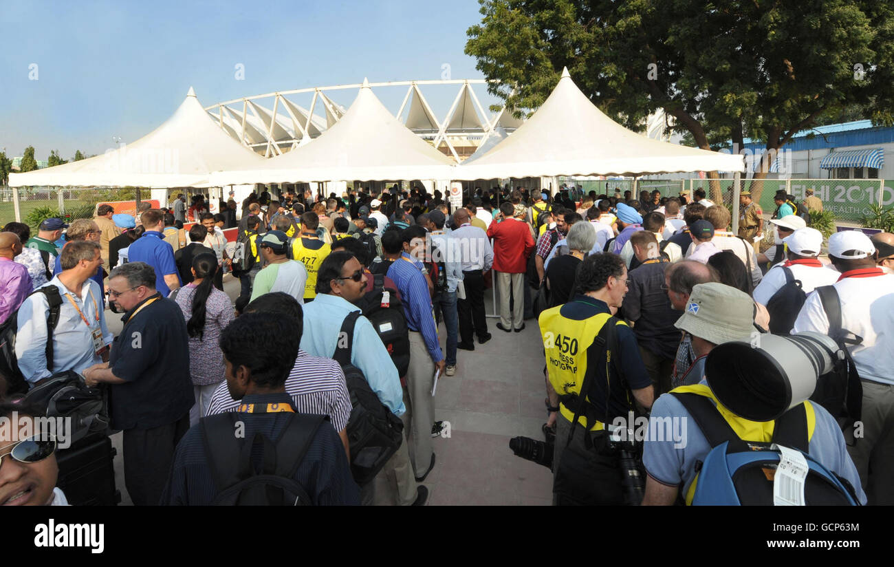 Media queue at security checks outside the Jawaharlal Nehru Stadium, in New Delhi, India, ahead of the 2010 Commonwealth Games opening ceremony. Stock Photo