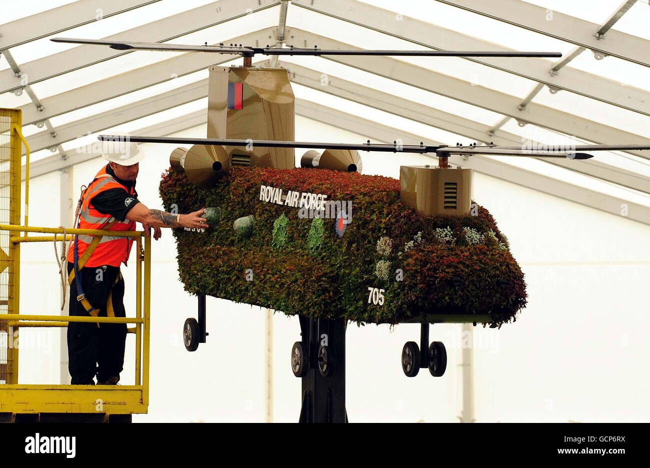 Grounds man George McArevey (left) prepares a replica of a Chinook helicopter for the award winning Help for Heroes Garden at the Birmingham Gardeners' Show, Kings Heath Park, Birmingham. Stock Photo