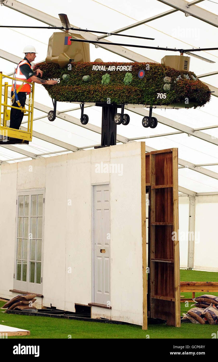 Grounds man George McArevey (left) prepares a replica of a Chinook helicopter for the award winning Help for Heroes Garden at the Birmingham Gardeners' Show, Kings Heath Park, Birmingham. Stock Photo