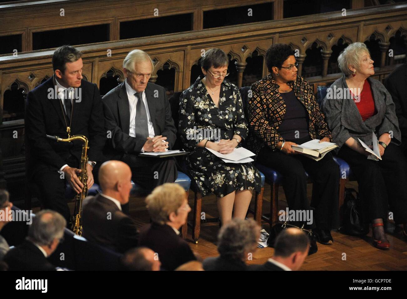 The speakers, Tommy Smith (left), Rt Hon George Reid (second left), Jackie Kay (second right) and Liz Lochhead (right) attend the funeral service for Edwin Morgan, Scotland's first national poet, in Bute Hall at the University of Glasgow. Stock Photo