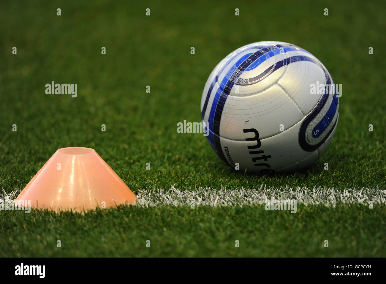 Soccer - npower Football League Championship - Leicester City v Cardiff City - Walkers Stadium. Detail of a training cone and match ball on the pitch Stock Photo