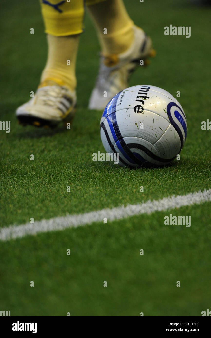 Soccer - npower Football League Championship - Leicester City v Cardiff City - Walkers Stadium. Detail of a match ball as a Cardiff City player jogs past during the warm up Stock Photo