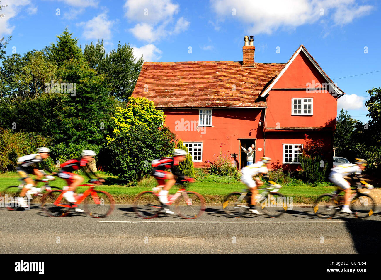 Cycling - 2010 Tour of Britain - Stage 7 - Bury St Edmonds to Colchester. Cyclists pass through the village of Cavendish in Suffolk during stage 7 of the Tour of Britain. Stock Photo