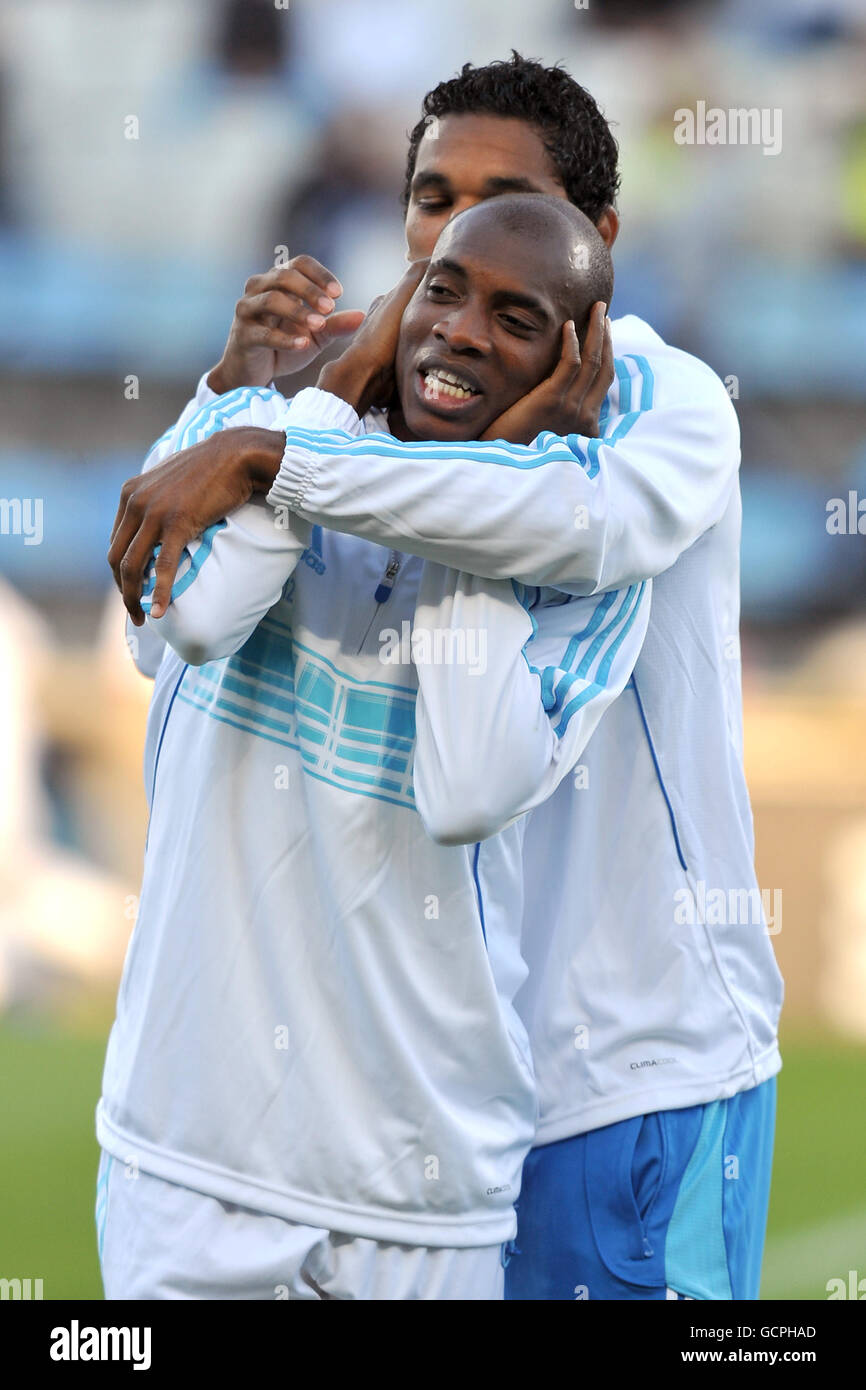Olympique de Marseille's Charles Kabore (left) and Brandao shake a joke in pre-match training Stock Photo