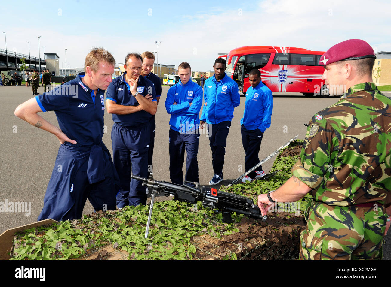 Members of the England U21 squad are shown a selection of weapons used by the army in combat, during a tour of 16 Air Assault Brigade and Colchester Garrison, Colchester. Stock Photo