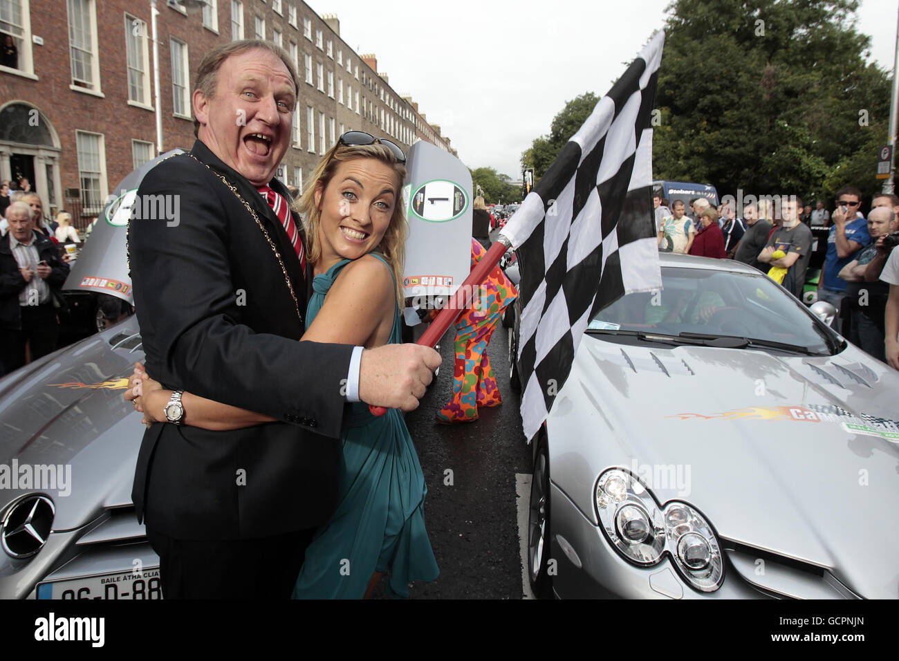 Lord Mayor of Dublin Gerry Breen and TV presenter Kathryn Thomas with the checkered flag at the start start of Cannonball Run 2010 in Merrion Square, Dublin. Stock Photo