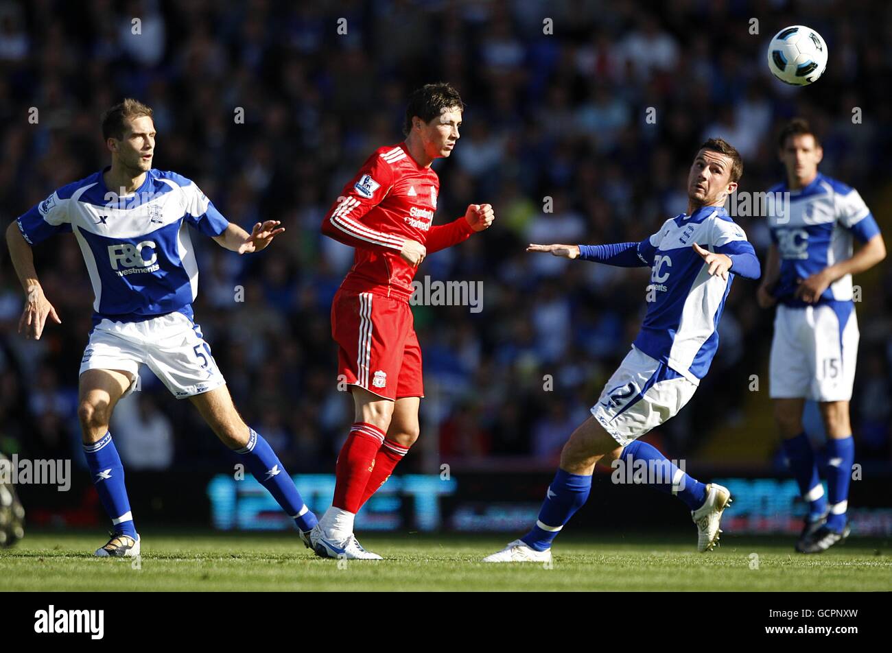 Liverpool's Fernando Torres, right, heads the ball past Real Madrid 's  Pepe, of Brazil, during a Champions League, Round of 16, first leg soccer  match against Real Madrid at the Santiago Bernabeu