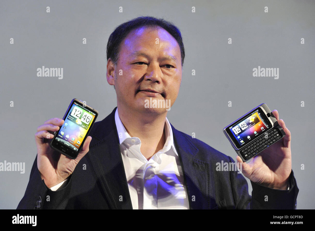 Peter Chow, Chief Executive Officer of mobile phone company HTC, unveils  the HTC Sense experience with the new HTC Desire HD (left) and HTC Desire Z  smartphones, at Old Billingsgate Market in