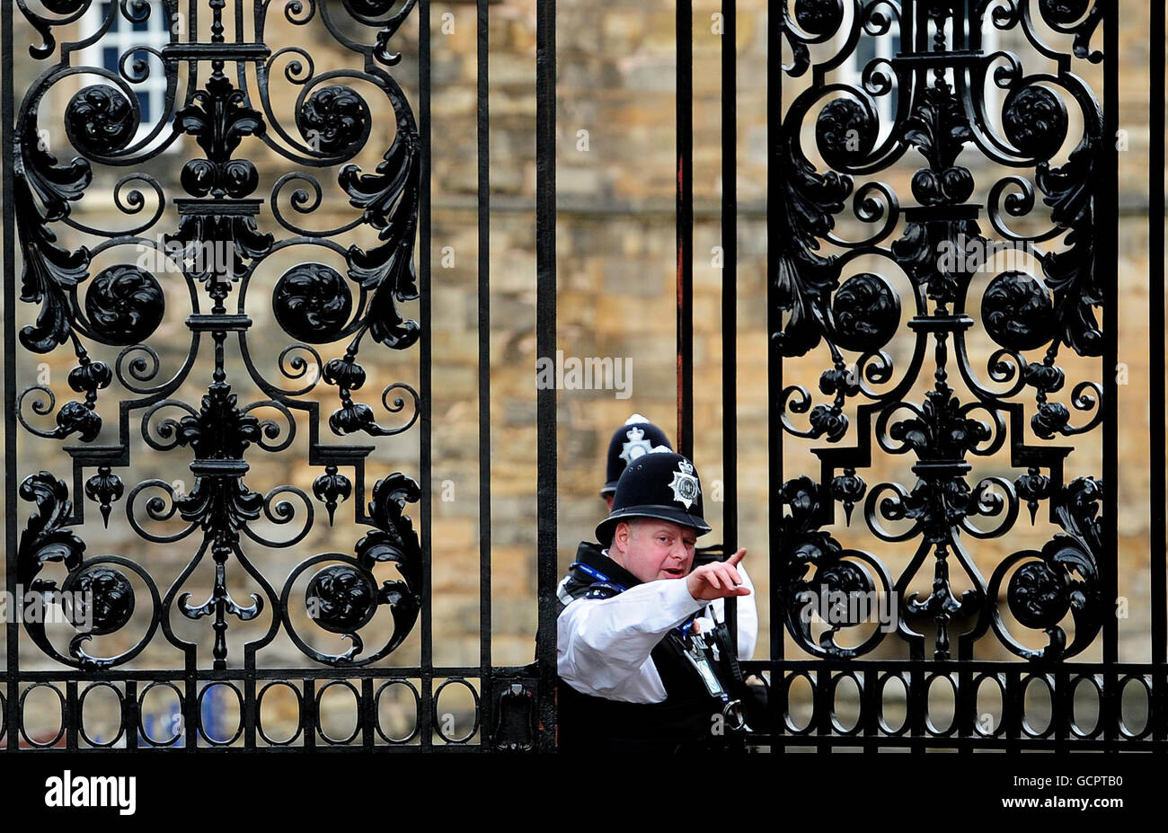 Police guard the Palace Of Holyroodhouse in Edinburgh, ahead of the