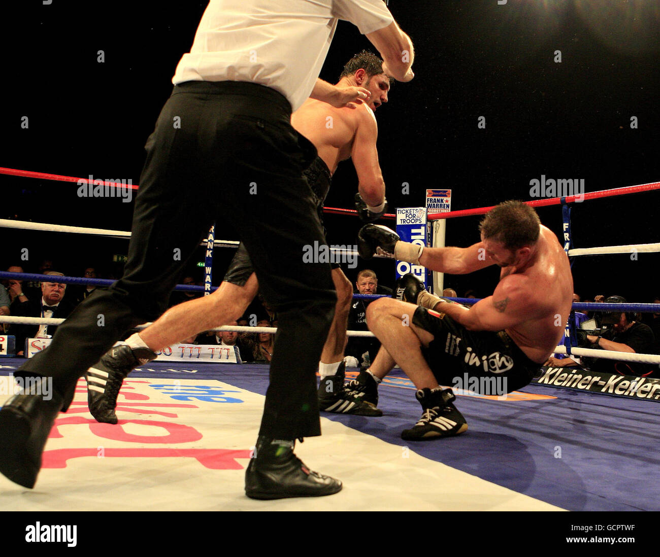United Kingdom's Enzo Maccarinelli (right) is knocked out in round seven by Germany's Alexander Frenkel during the European Cruiserweight Championship fight at the LG Arena, Birmingham. Stock Photo